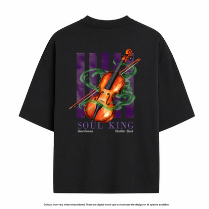 A black oversized t-shirt shown from the back, featuring a graphic print of an orange violin with green smoke and purple stripes, with the text 'SOUL KING' and 'Swordmaster Thriller Bark'.